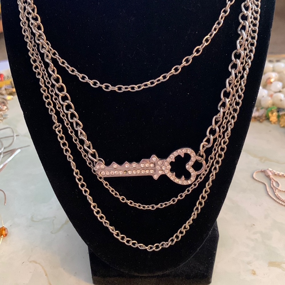 Horizontal gem Embellished key 4 strand necklace.